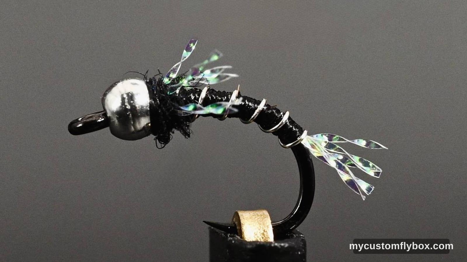 Black beadhead midge fly with silver ribbing and flash on a curved hook