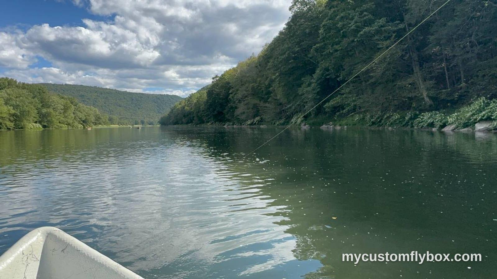 A broad Catskills trout pool viewed from a boat while fly fishing